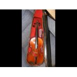 An old violin in wooden carrying case