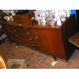 A retro A.Younger Ltd teak sideboard with four cen