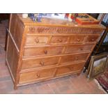 An oak chest of drawers