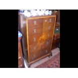 A 1920's chest of five long drawers