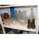 An assortment of cut glass decanters and other gla