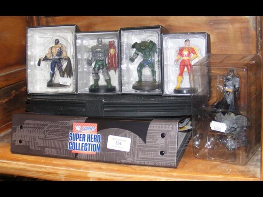 A selection of 5 boxed DC figures with stand i