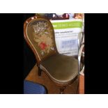 A Victorian nursing chair with beaded back rest