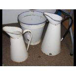 Two vintage enamel jugs together with a bucket