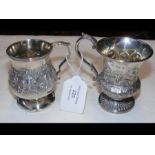 A silver tankard - 8cm high and one other