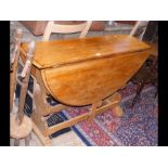 A narrow drop leaf table