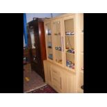 The matching three door display cabinet with drawe