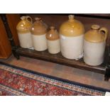 Five antique stoneware flagons