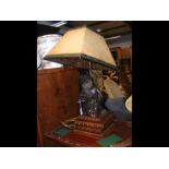A decorative figural table lamp - 70cms high
