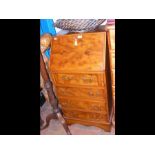 A walnut effect bureau with inset leather top - wi