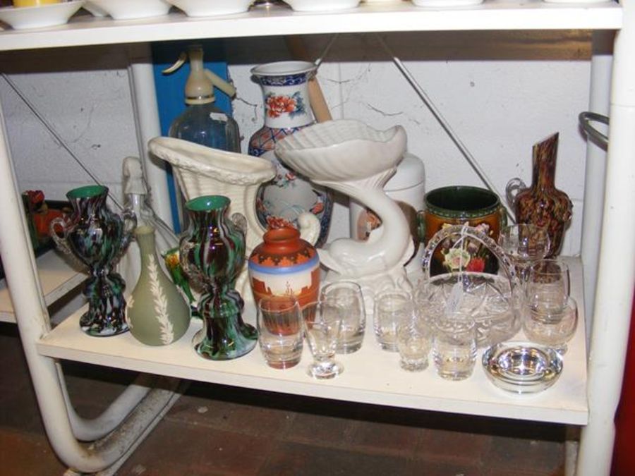An assortment of collectable glass and ceramic war