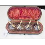 A cased set of four silver and ivory 'horn' menu h