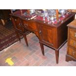 An Edwardian desk with square tapering supports
