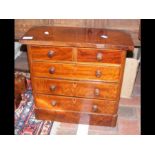 An antique miniature chest of two short and three