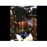 A gent's Victorian style button back armchair