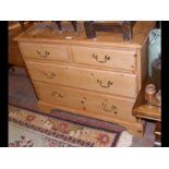 A pine chest of two short and two long drawers