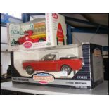 A boxed Ertl Mustang together with Coca-Cola deliv