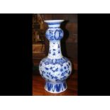 A blue and white antique delft bottle vase - 33cms