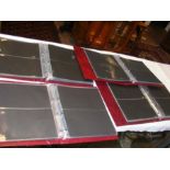 Four empty First Day Cover binders