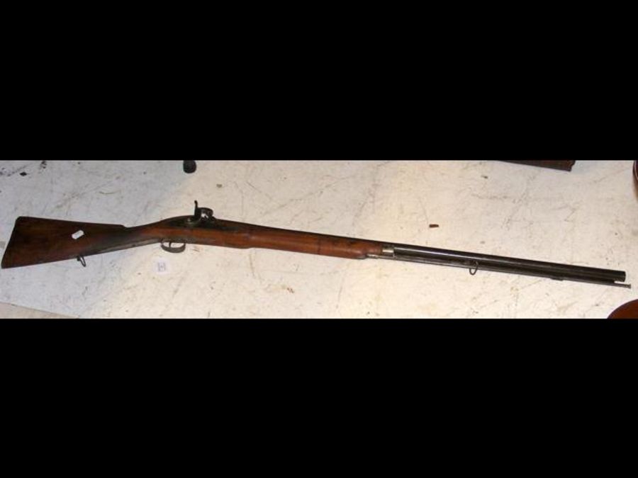 An antique rifle with metal ram rod - 125cm long