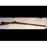 An antique rifle with metal ram rod - 125cm long