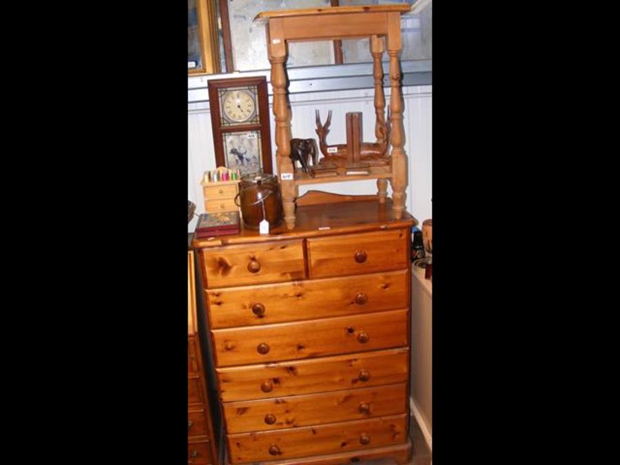 A lacquered pine chest of two short and five long