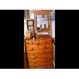 A lacquered pine chest of two short and five long