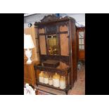 A Victorian carved oak hall stand with mirrored ba