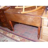 A Victorian drop-leaf table