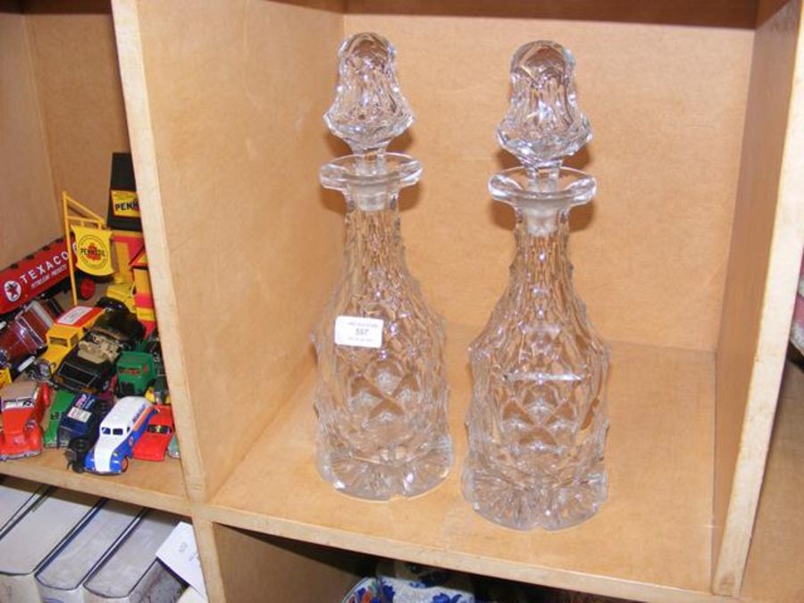 A pair of cut glass decanters with stoppers