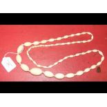 A Victorian ivory beadwork necklace