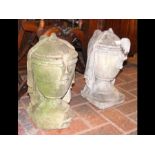 A pair of stone urns, each draped with cloth - 40c