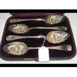 A cased set of four silver berry spoons