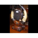 An antique horn plated dinner gong