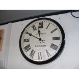 A large wall clock with Roman numerals