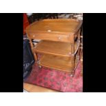 A three tier Ercol tea trolley with single drawer