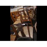 A set of four antique dining chairs together with