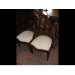 A pair of inlaid Edwardian drawing room chairs