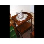 An antique washstand with jug and bowl