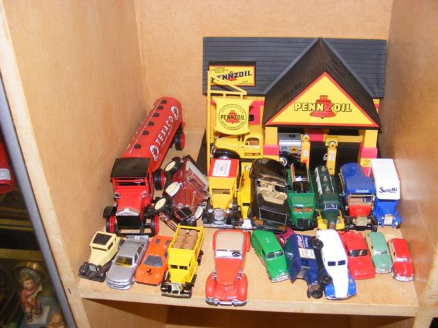 Die cast model vehicles including petrol station