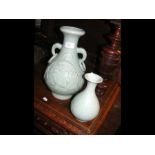 A celadon vase together with a smaller ditto, the