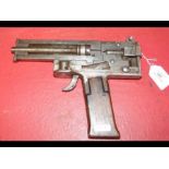 An old cross sectioned humane killer pistol