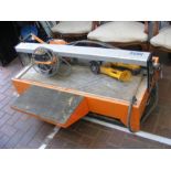 A large tile cutter together with three Dewalt pow