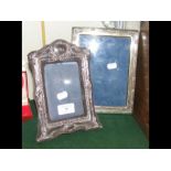 A silver photo frame and one other