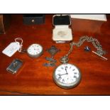 A silver pocket watch together with badges etc