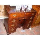 A Georgian mahogany knee-hole writing desk with se