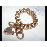 A 9ct gold chain bracelet with heart clasp