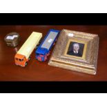 A miniature portrait, together with two Dinky Toys