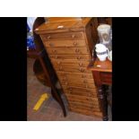 A pine artists supply chest of fifteen drawers - w