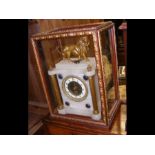 A French alabaster mantel clock with lion surmount